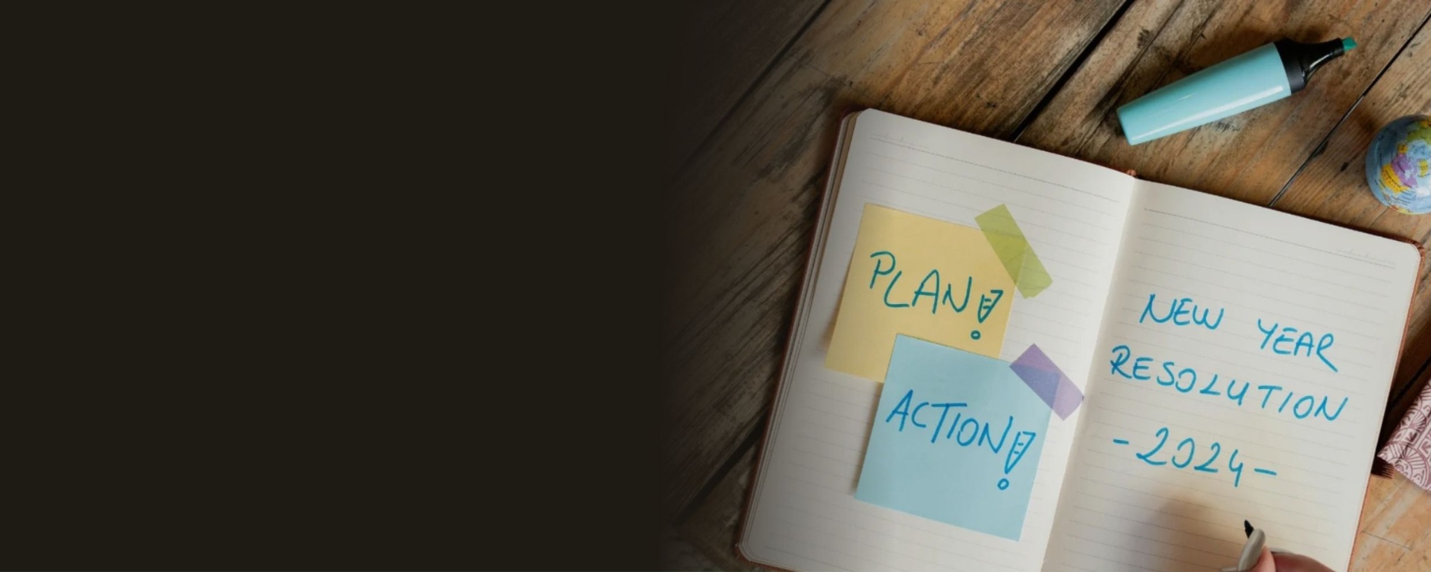 Open notebook with planning notes on a wooden table