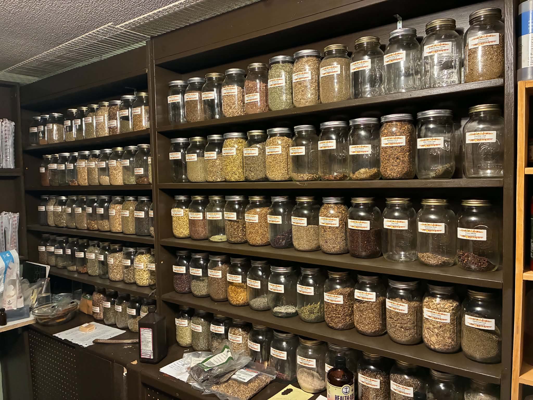 Shelves filled with herbs at Green Witches Corner.